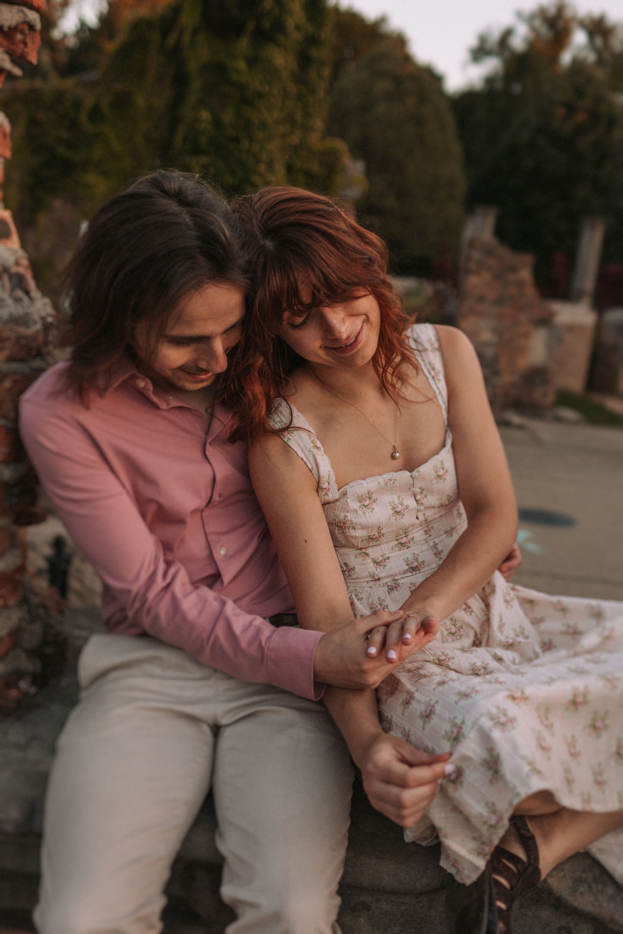 A romantic moment shared on stone steps during golden hour.