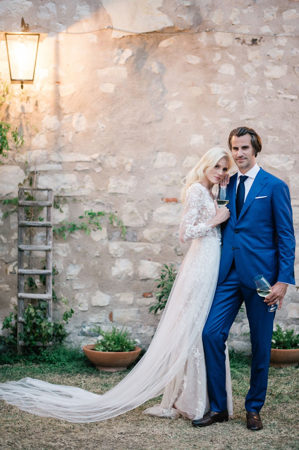 Bride and groom posing during their wedding at a charming ancient residence on Lake Iseo