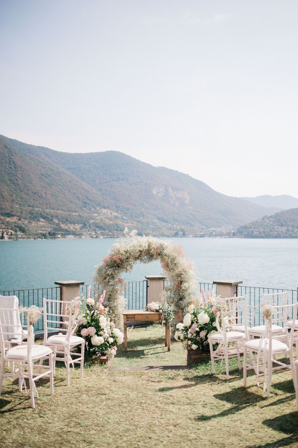Panoramic terrace set for an intimate wedding ceremony overlooking Lake Iseo