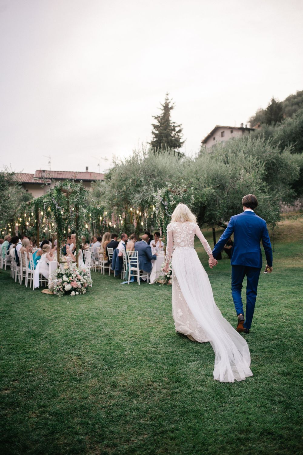 Bride and groom arriving to the reception for their destination wedding at Lake Iseo