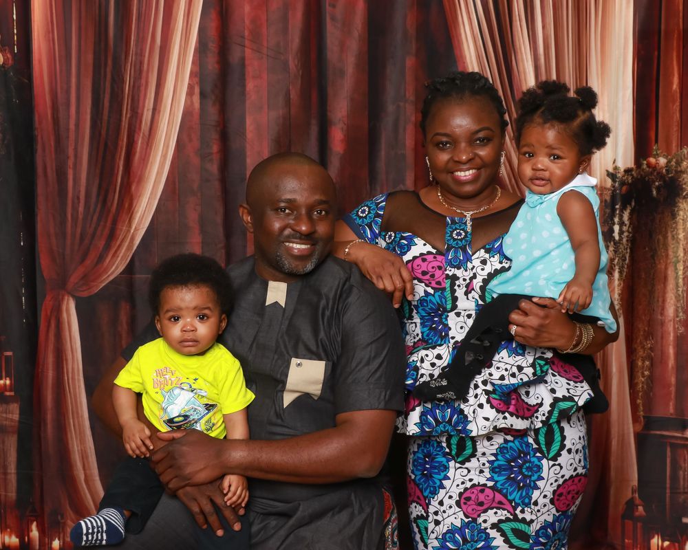 Family studio portrait with soft lighting and neutral backdrop in Miramichi