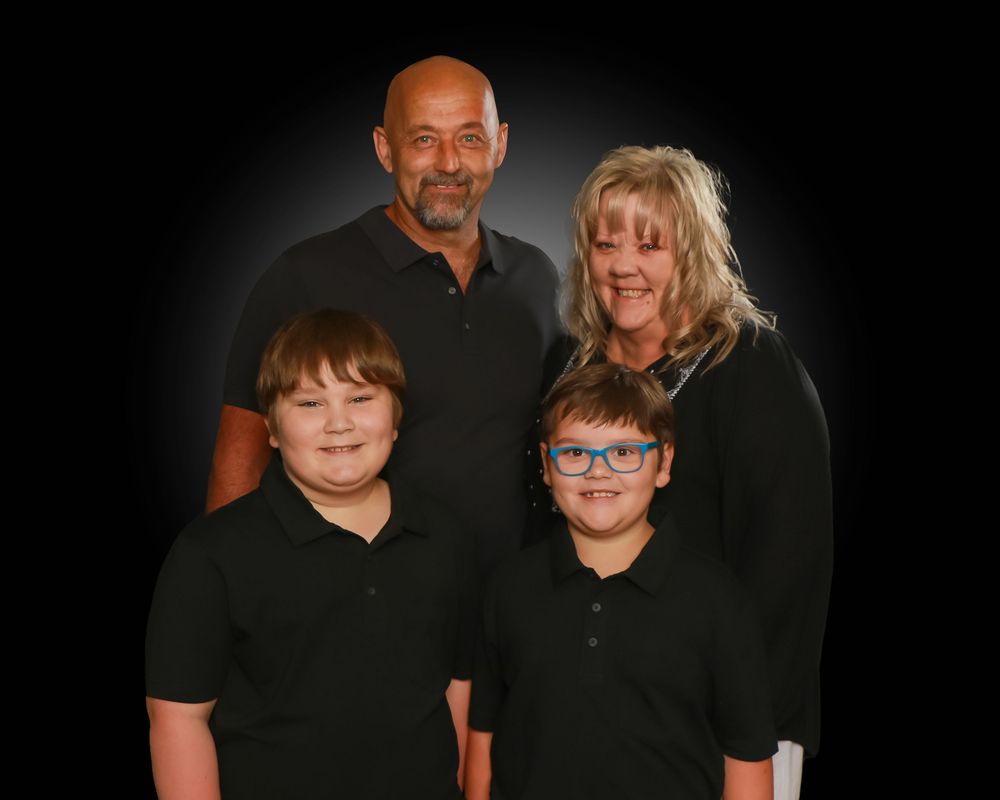 Family studio portrait with soft lighting and neutral backdrop in Miramichi