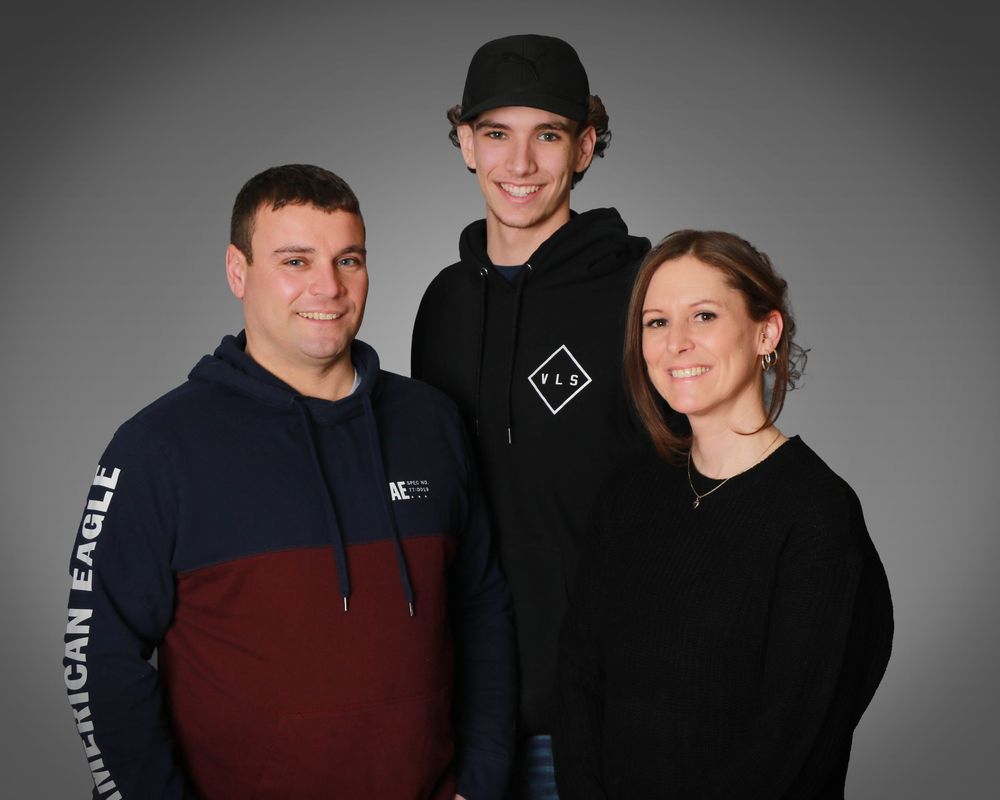 Family studio portrait with soft lighting and neutral backdrop in Miramichi