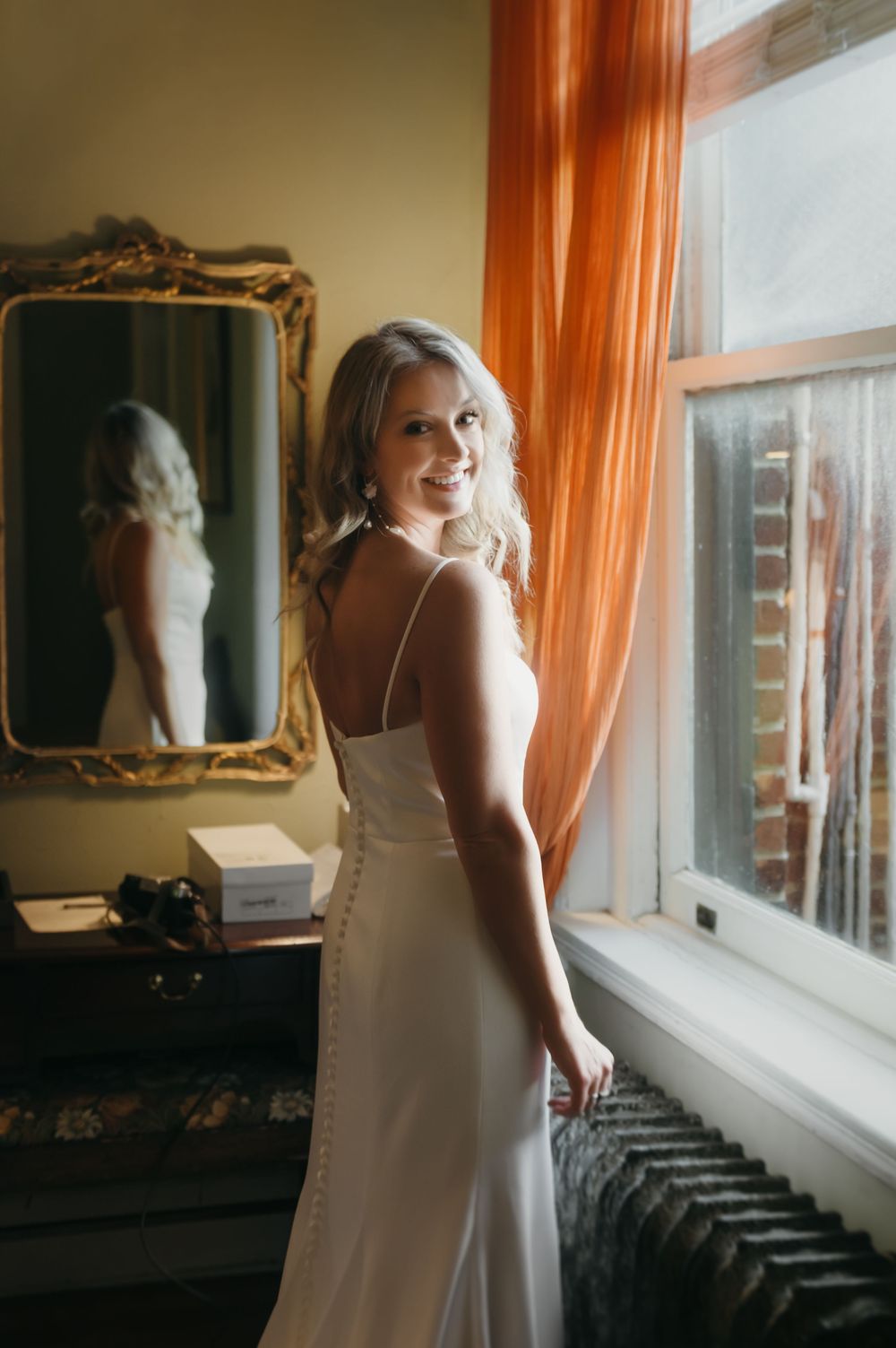 A series of sunlit photos showing a person in white near a window with sheer curtains.