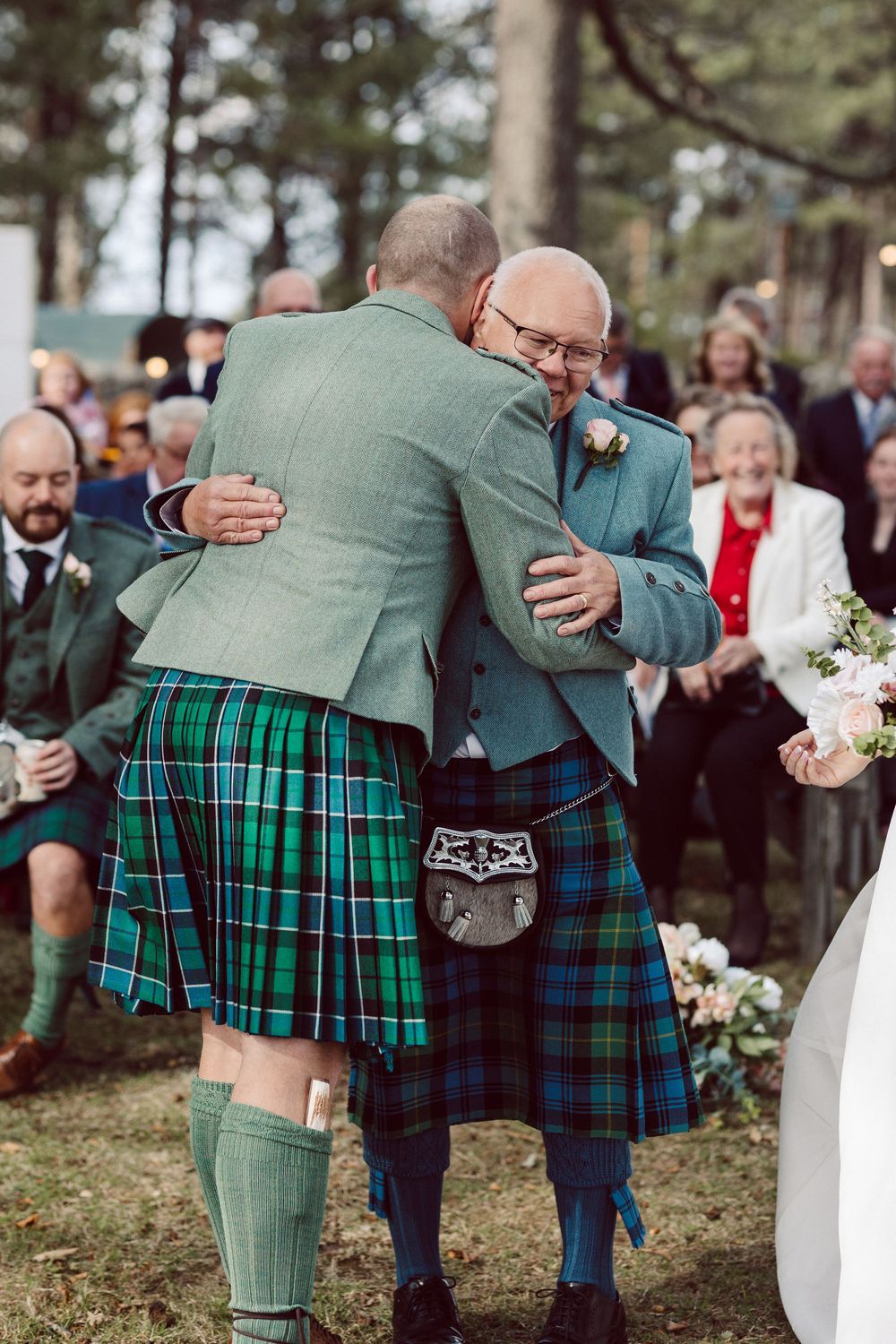 A sequence of photos showing people wearing traditional Scottish kilts and formal attire embracing at an outdoor gathering.