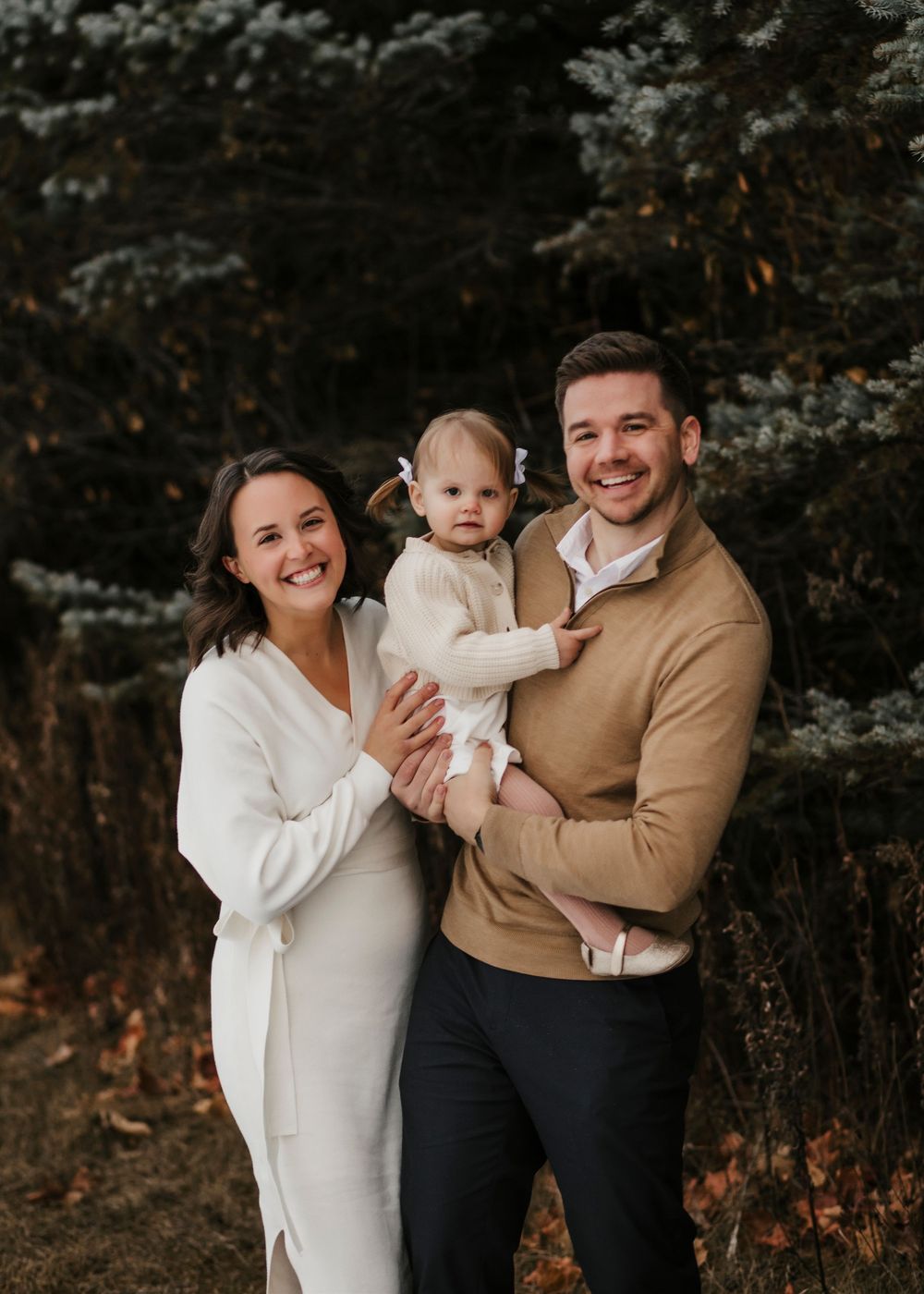 Candid family moments captured during an outdoor winter photo session.