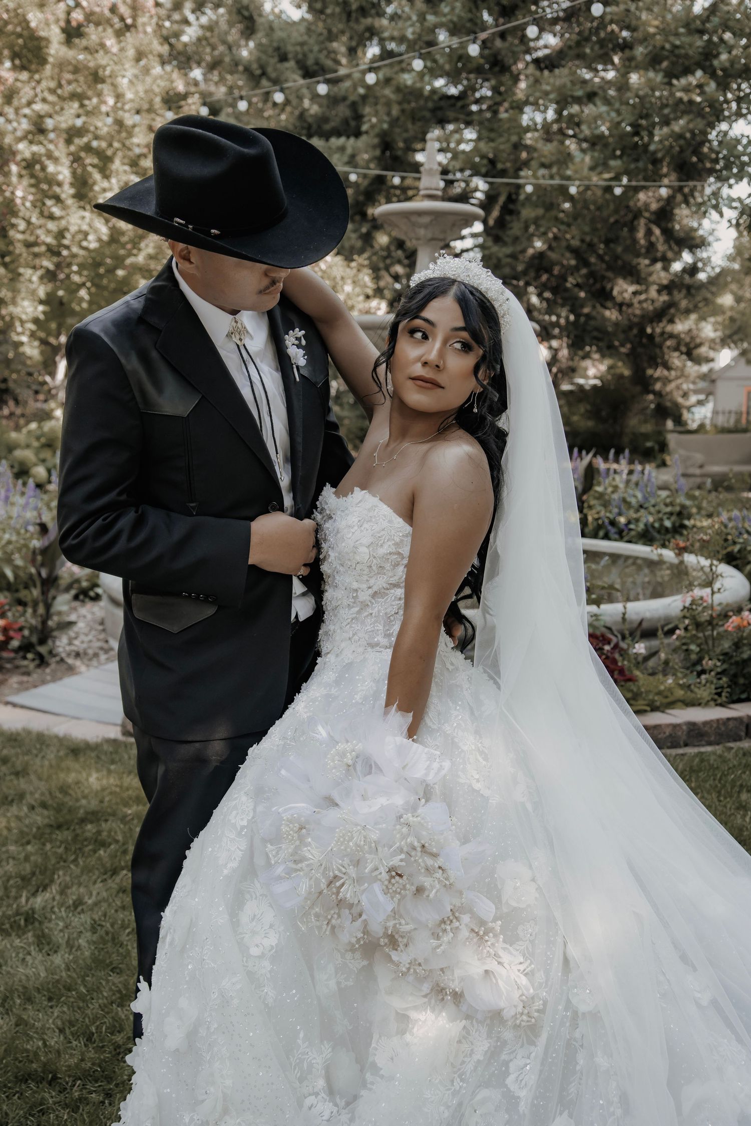 Bride and Groom pose with each other on wedding day