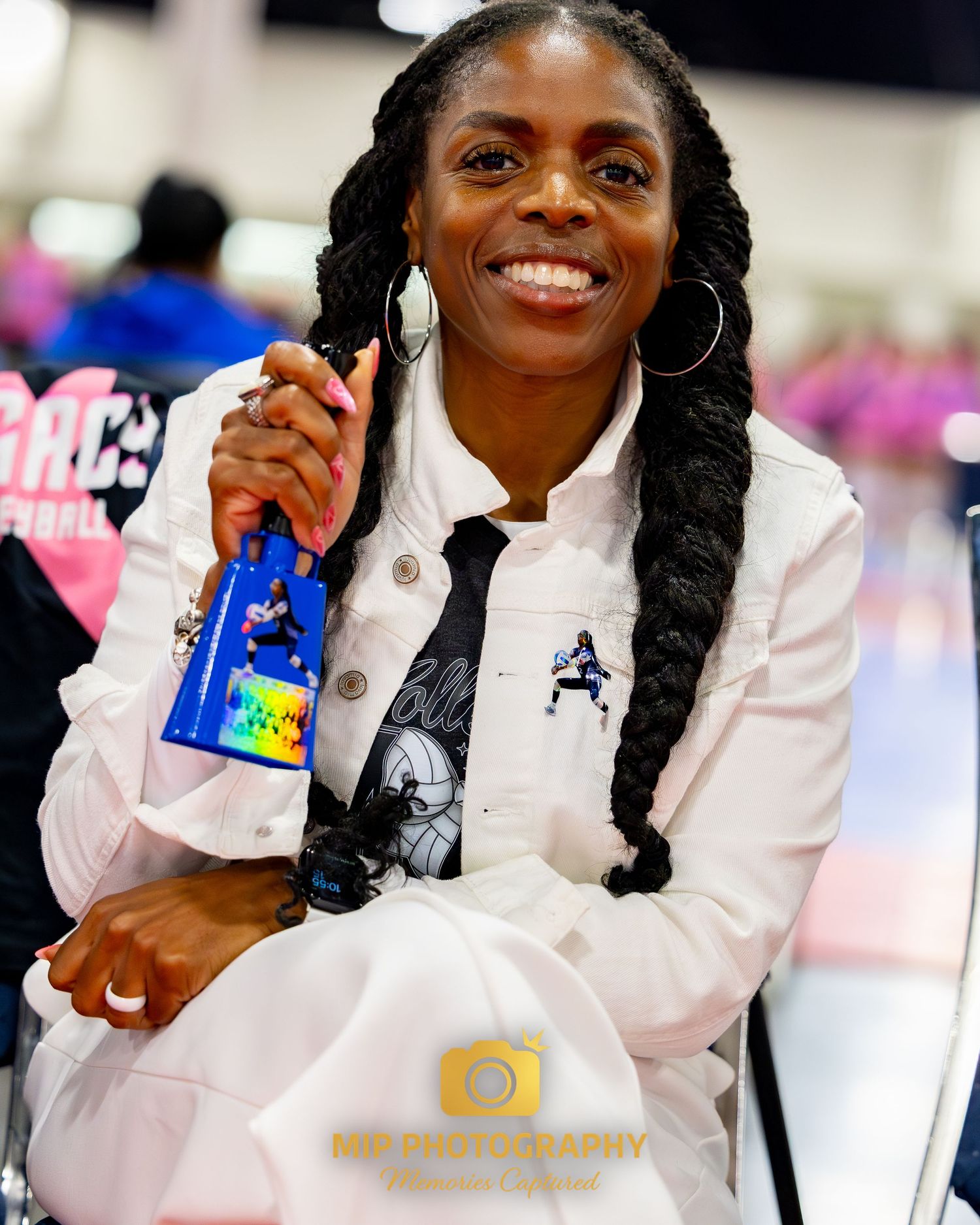 A person in a white lab coat smiles while holding a blue Walmart prescription bag in a pharmacy setting.