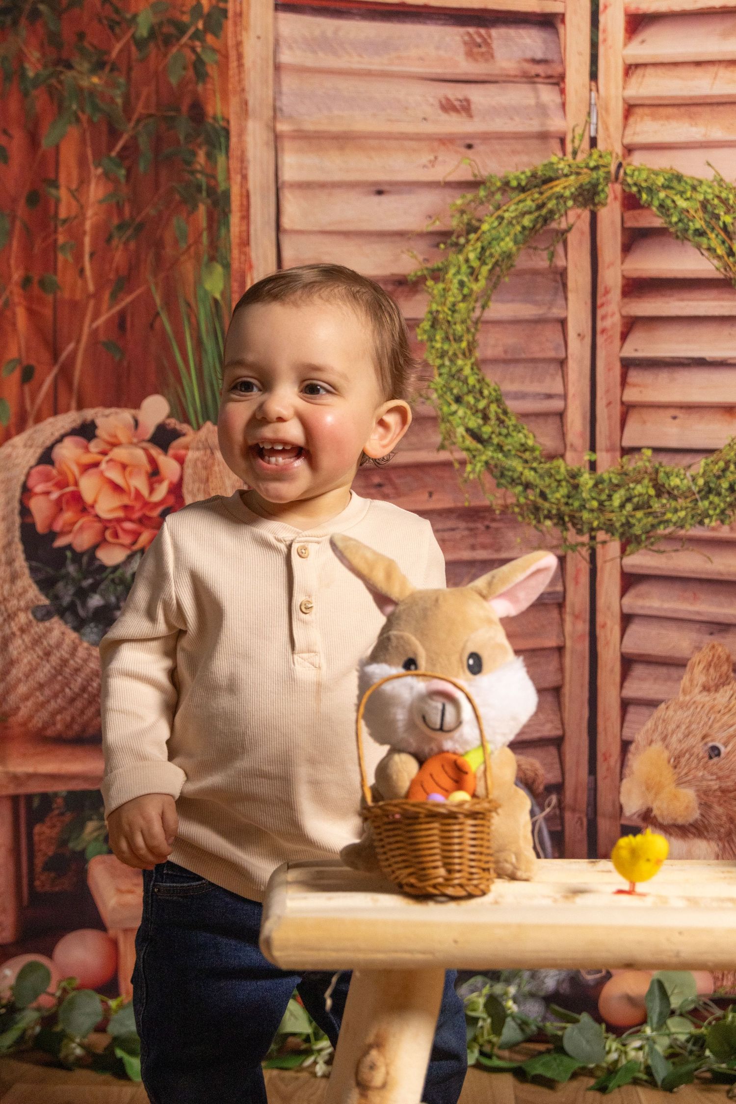 A sequence showing a young child playing with Easter decorations and toys on a rustic set with wooden shutters.