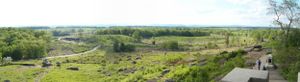 Rolling green hills and forests stretch across the scenic landscape of Valley Forge National Park.