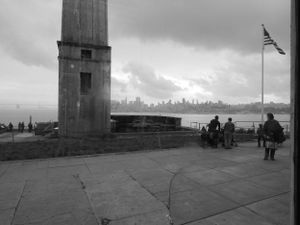 Black and white panorama of observation deck overlooking city skyline.