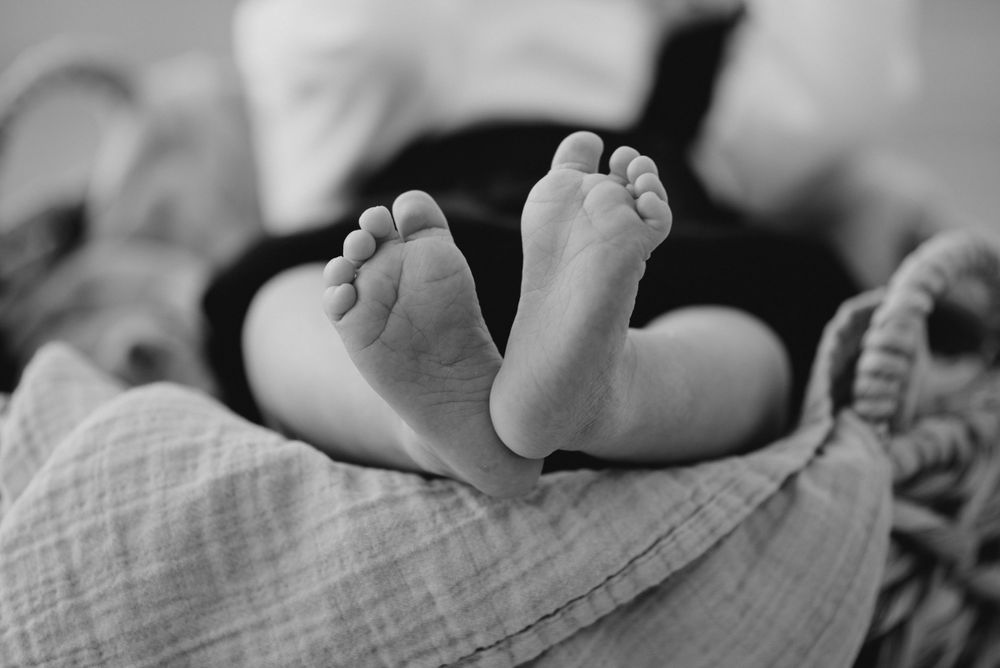 baby feet in black and white in florida