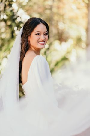 bright, vibrant portrait of a bride and her billowing white veil in st augustine florida.