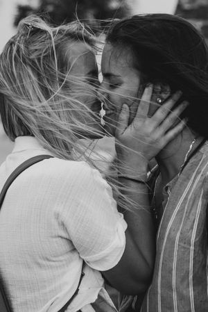 A portrait of two women kissing right after getting engaged in St. Augustine, Florida.