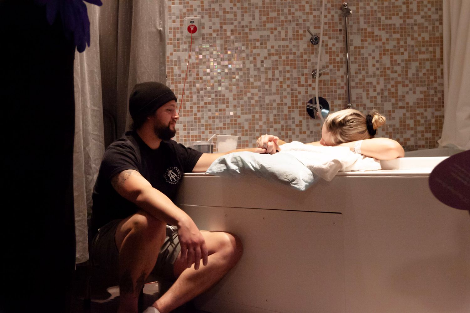 Husband and wife laboring through while awaiting the arrival of their newborn baby.