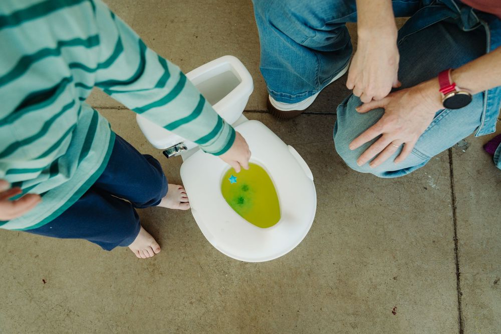 Wizzy Fizzies founder Angie mixing colors with her kids during a Denver brand photography session with McGlone Photography.