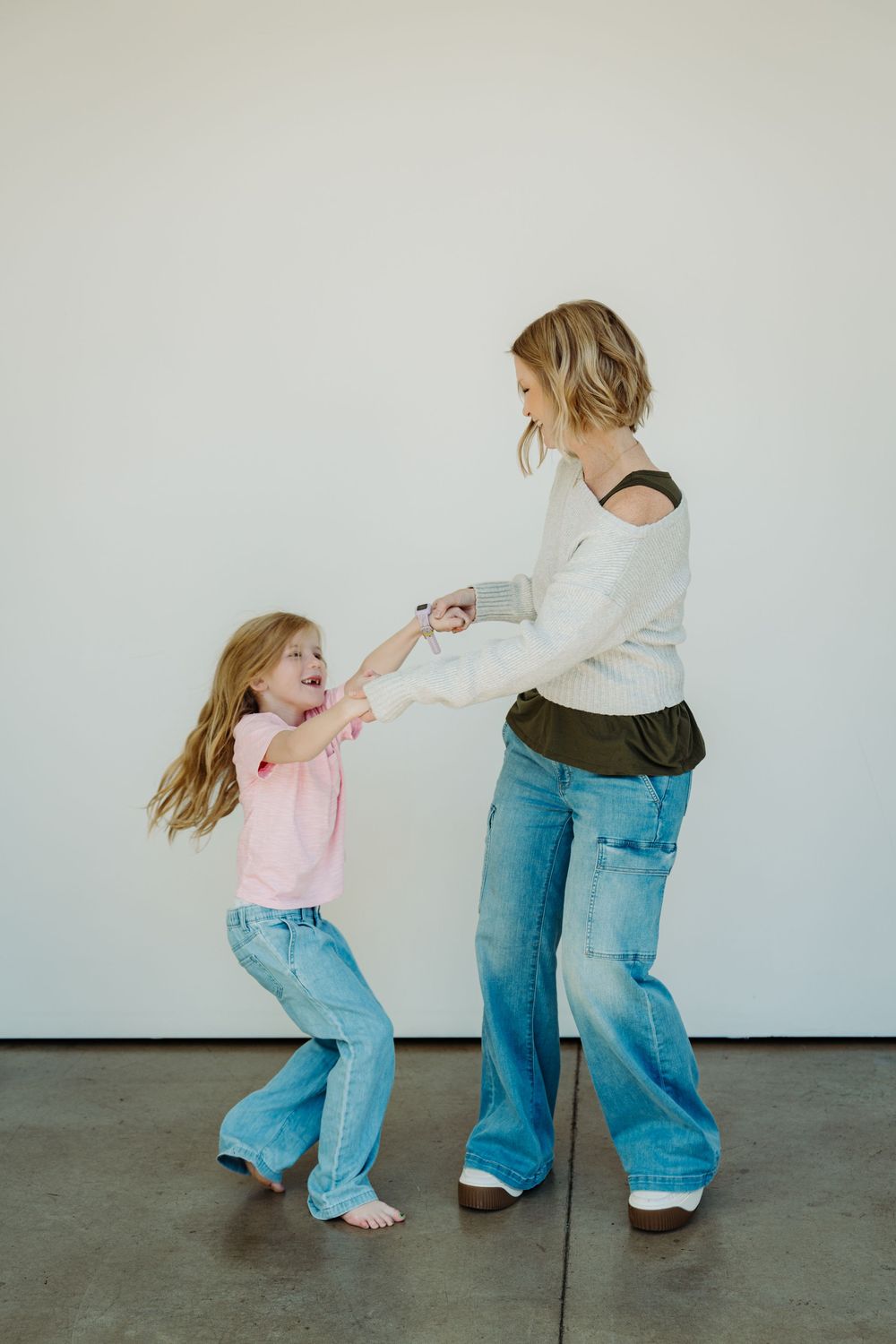 Angie dancing with her kids, captured by Denver brand photographer Kristin McGlone.