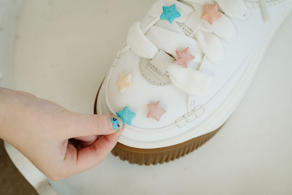 Wizzy Fizzies founder Angie mixing colors with her kids during a Denver brand photography session with McGlone Photography.