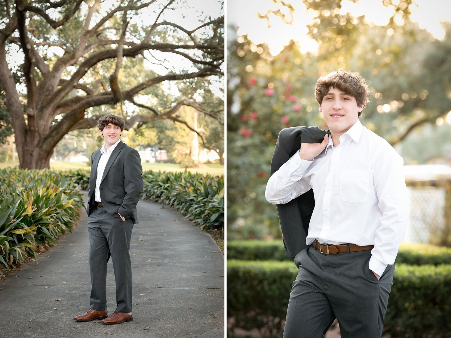 Young man in gray suit posing outdoors among lush greenery and oak trees for senior portraits.