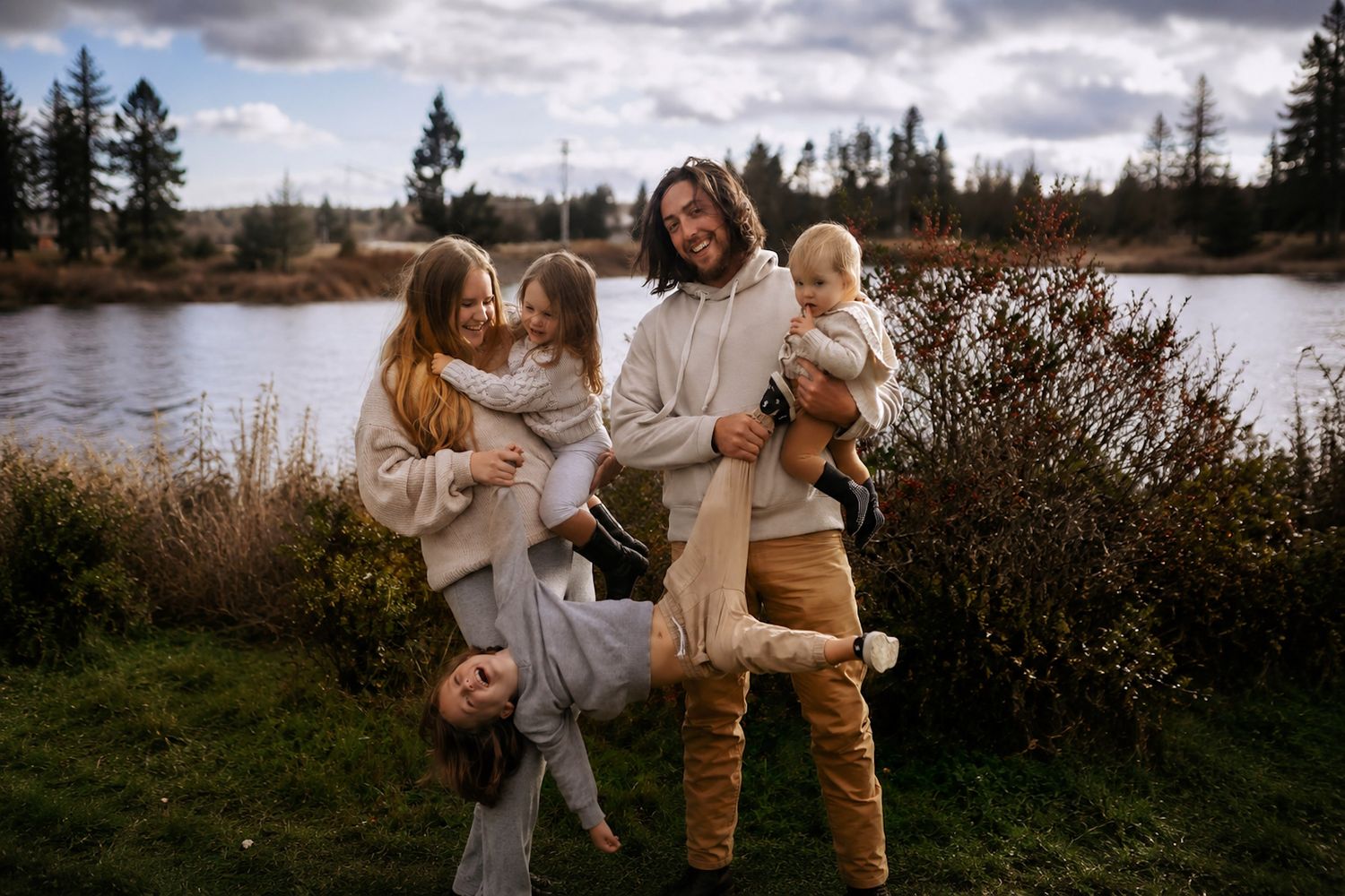 Halifax studio session with A family of seven poses for a professional portrait against a dark blue-gray studio background.