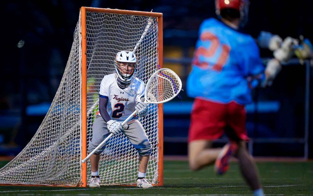Hershey Trojans goalie in action vs. Red Land Patriots, boys lacrosse by Deanna Fox, SportsFox Photography based in Hershey PA