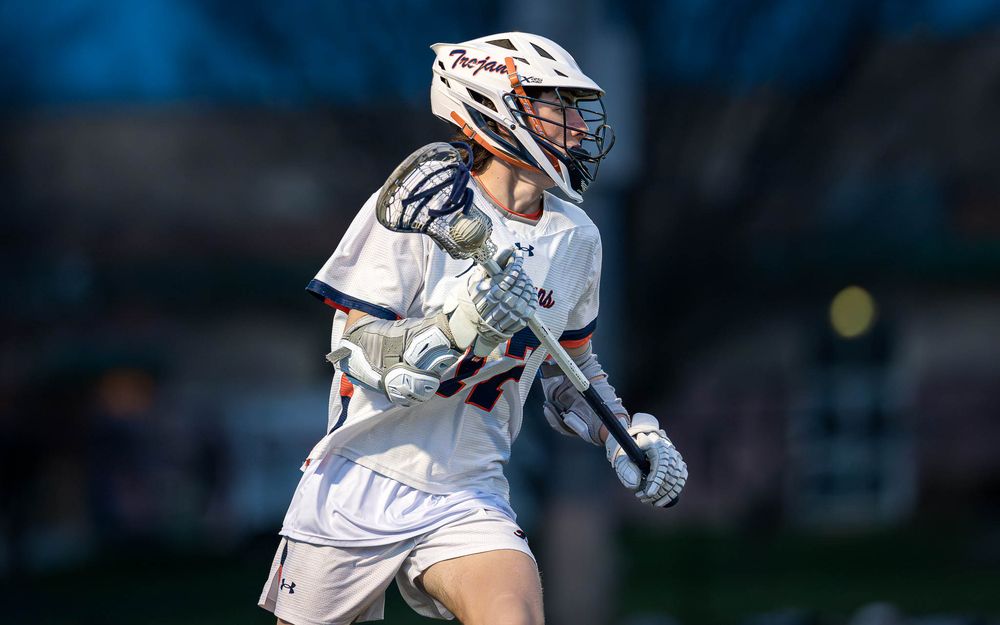 Hershey Trojans attacker drives to goal vs. Red Land Patriots, boys lacrosse by Deanna Fox, SportsFox Photography based in Hershey PA