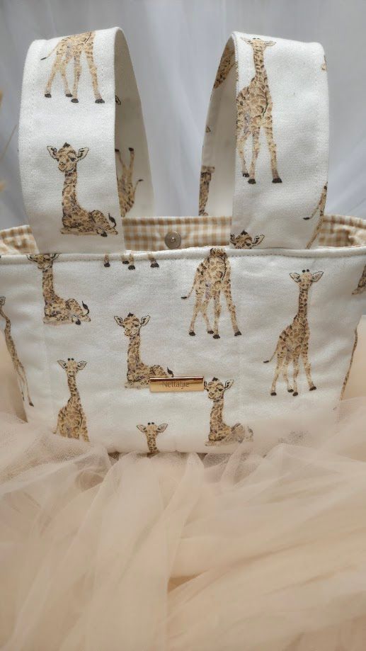Handmade fabric tote bag featuring adorable giraffe print on cream background with tan gingham lining and double handles.