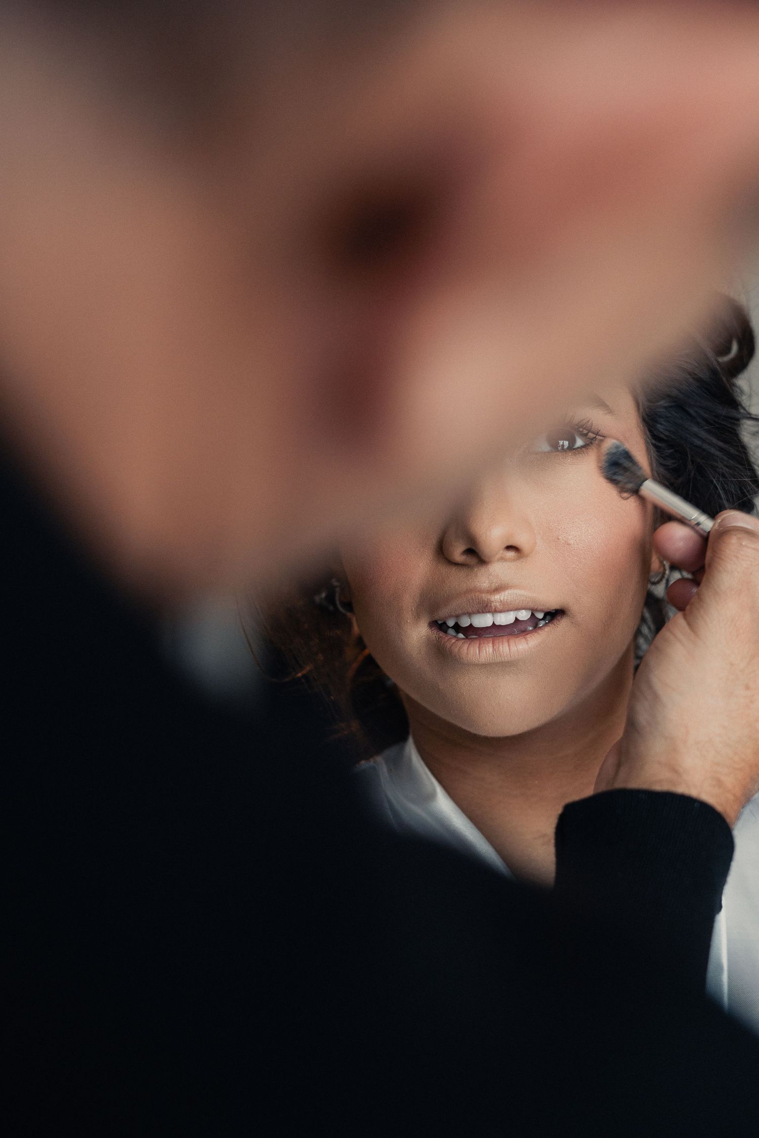 Close-up artistic portrait showing lips and partial facial features in soft, romantic lighting.