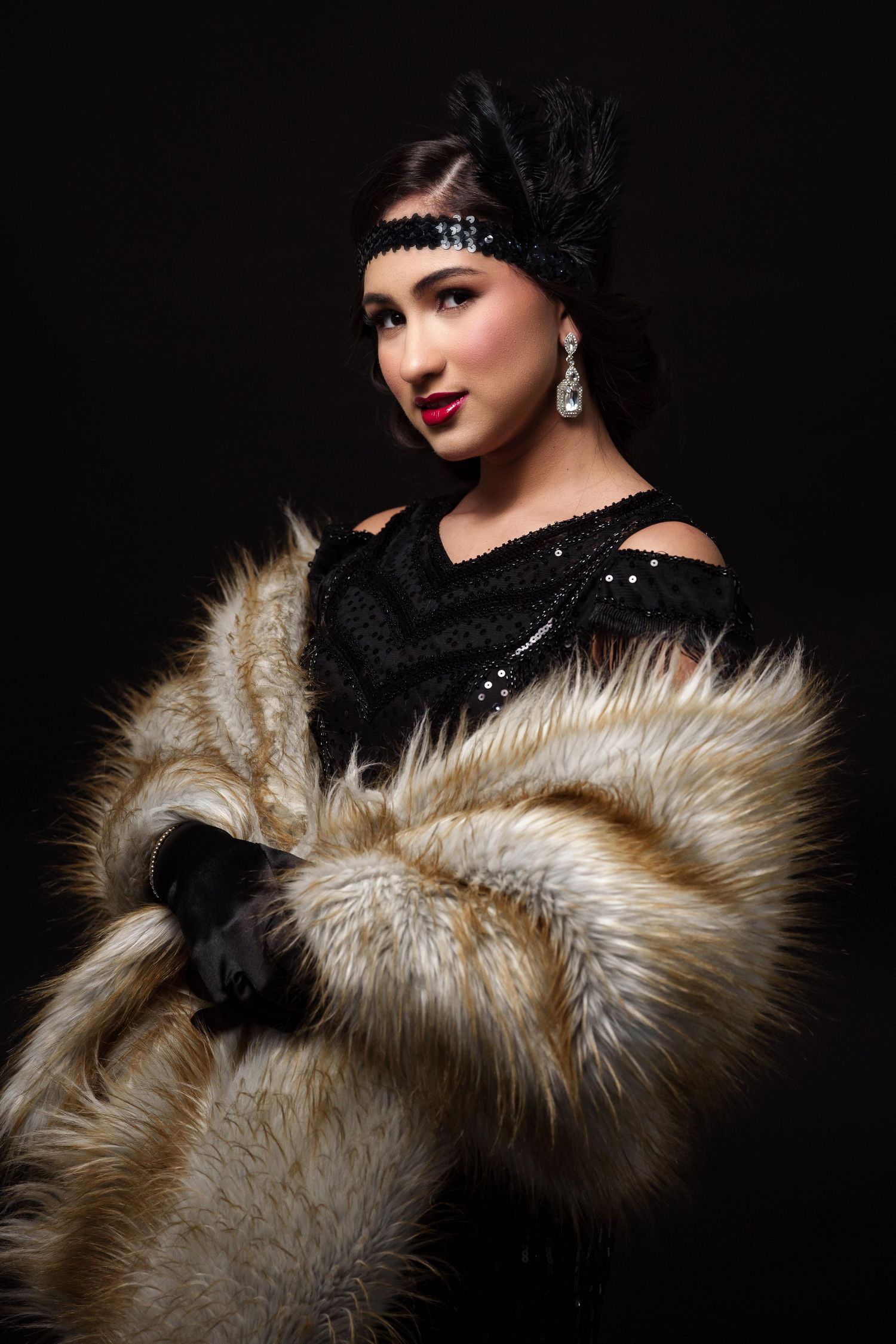 Glamorous vintage-style portrait series featuring luxurious fur stole and black sequin dress against dark background.
