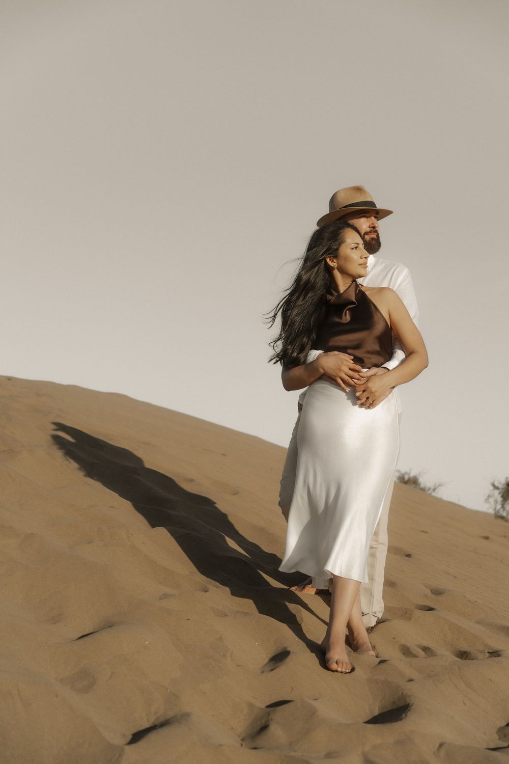 Intimate connection between a foreign couple, candid look during a luxury destination photoshoot.