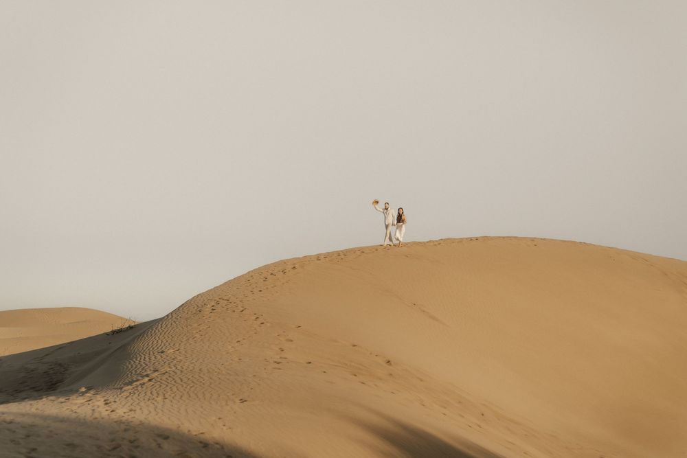 Spontaneous laugh and emotional embrace between a foreign couple during an adventure shoot.