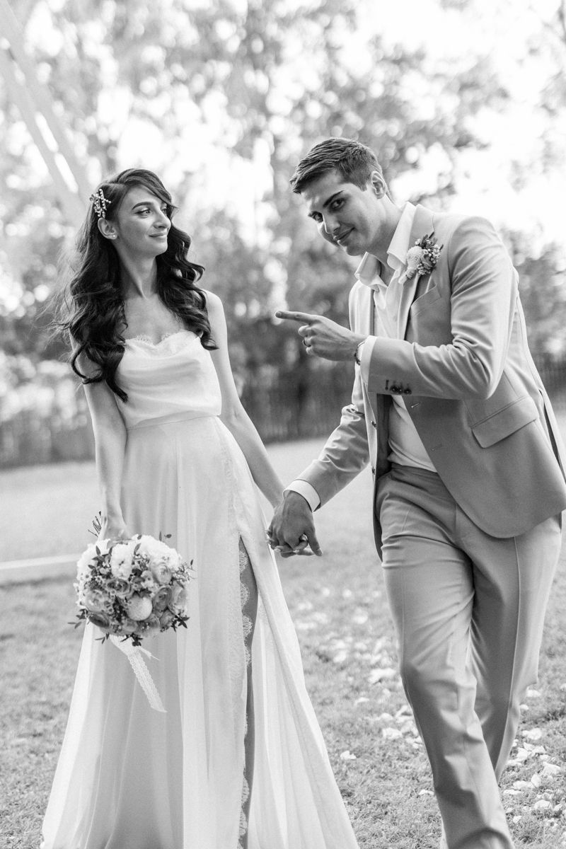Black and white candid shots of couple laughing together in garden wedding setting.