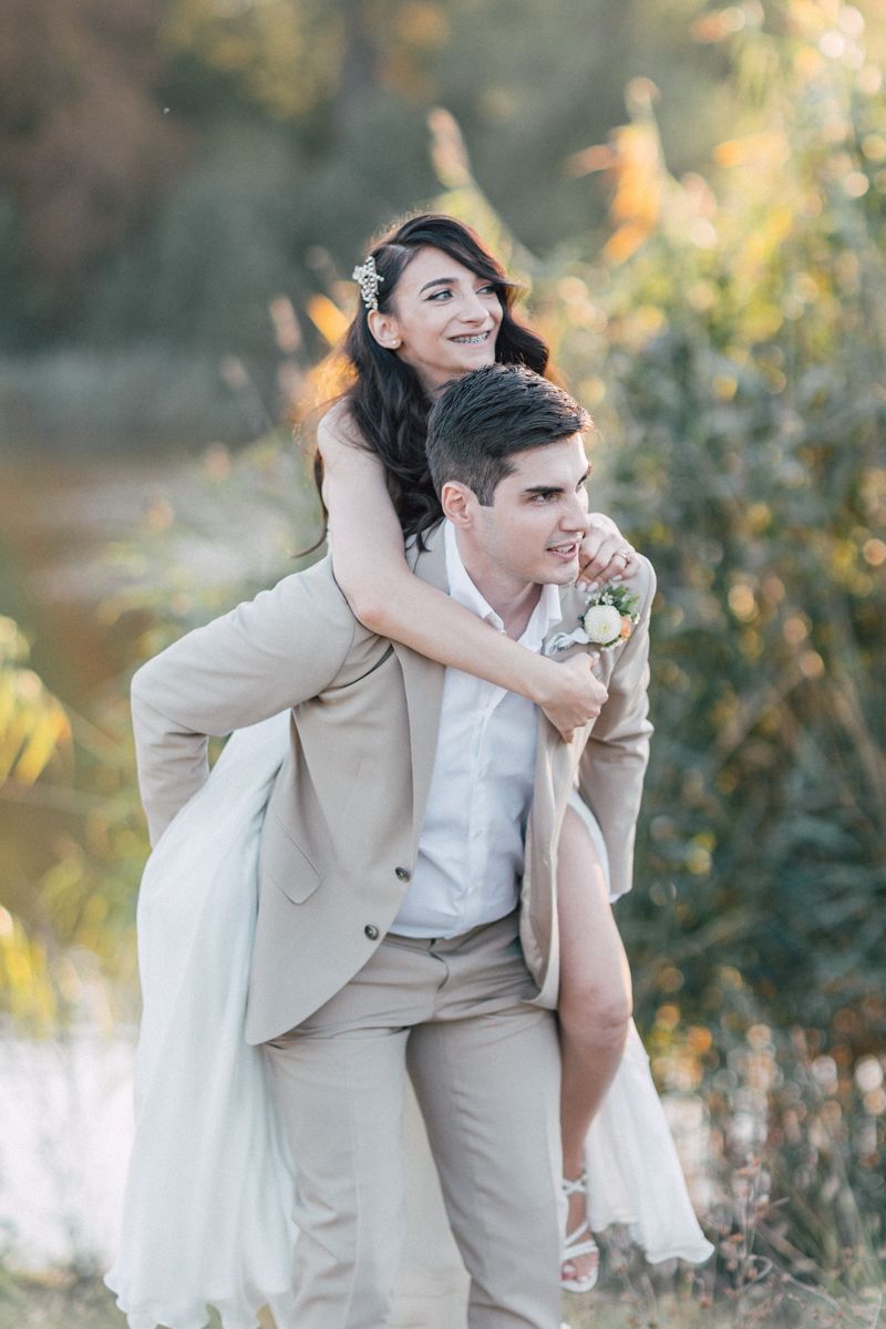 Playful wedding portraits showing intimate moments in warm afternoon light.