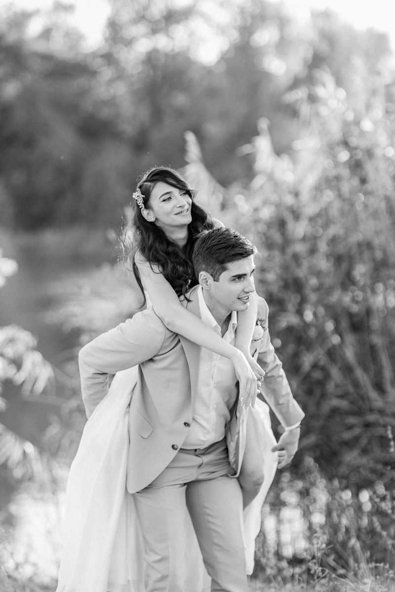 Black and white wedding photos capturing candid moments in a garden setting.