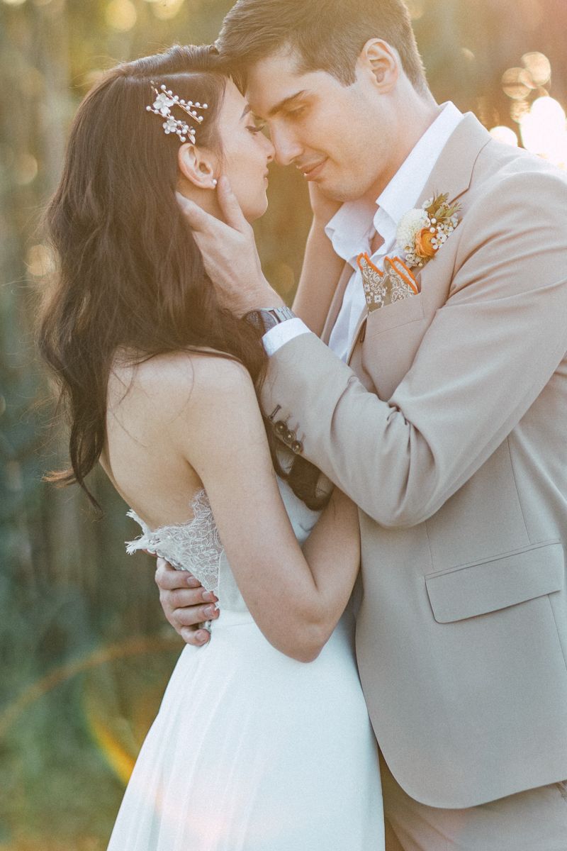 Intimate wedding portraits captured during golden hour with soft bokeh lighting.