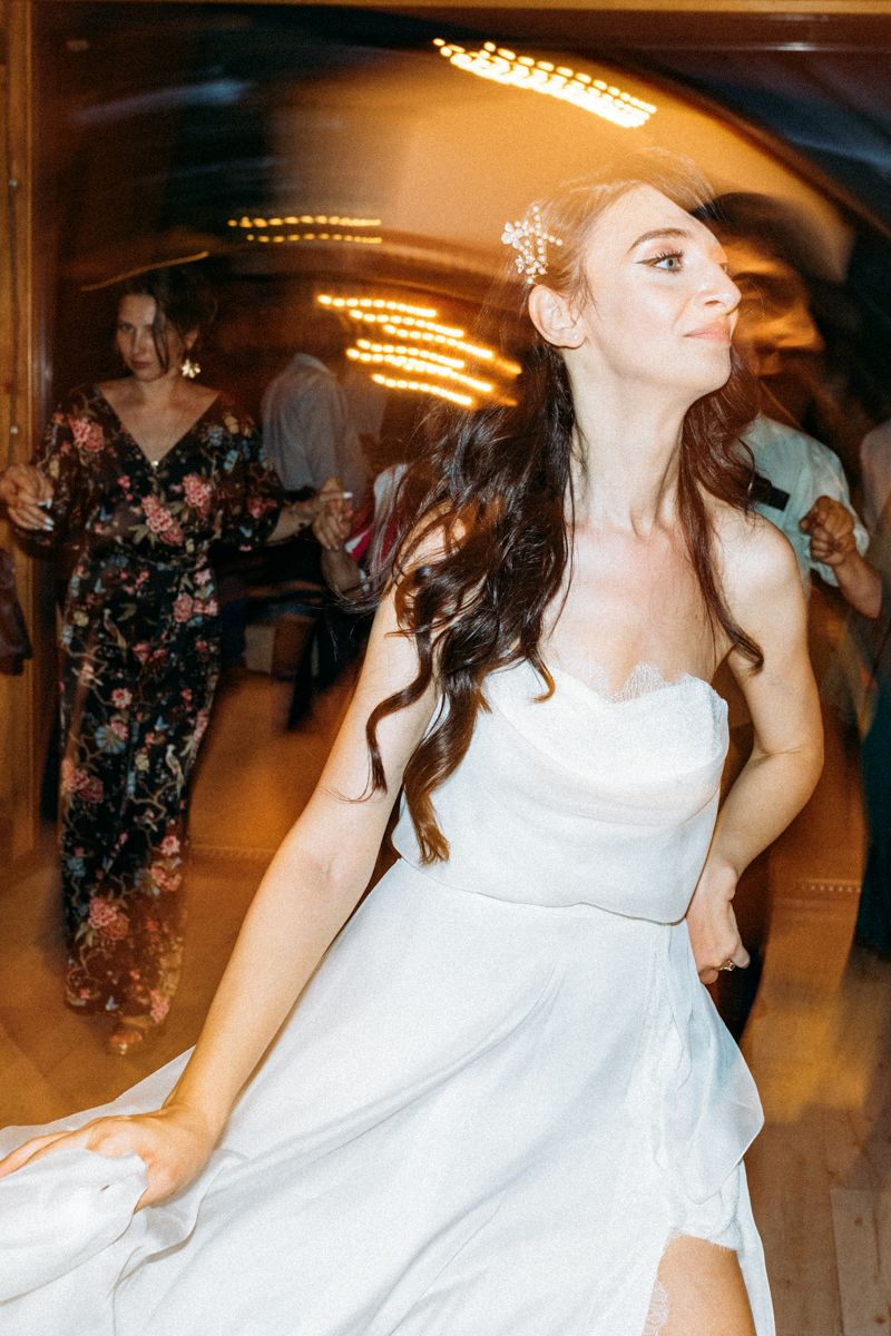Dynamic motion shots of dancing and celebration at indoor wedding reception.