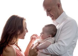 Four connected images show tender moments between parents and babies against a white background.