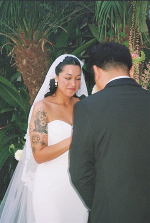 A sequence of outdoor wedding photos with a couple posing among tropical greenery and palm trees.
