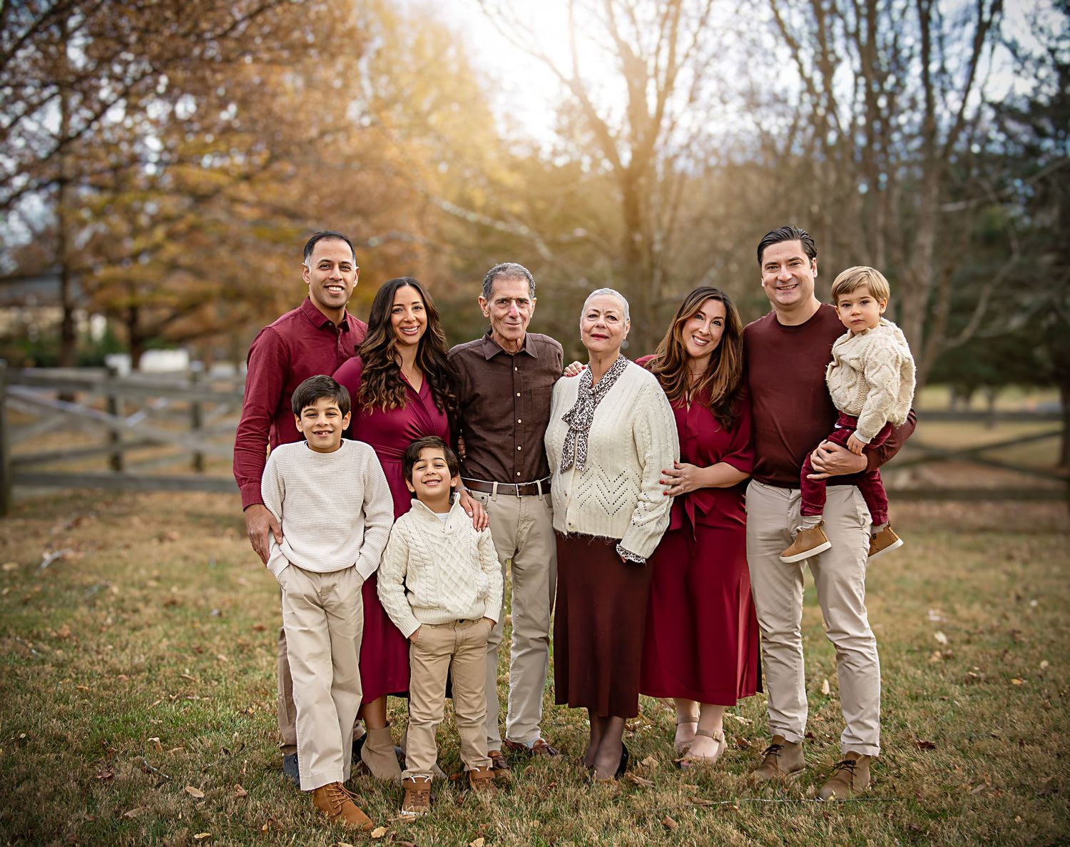 A series of coordinated outdoor family portraits taken at sunset showing people in burgundy and beige outfits.