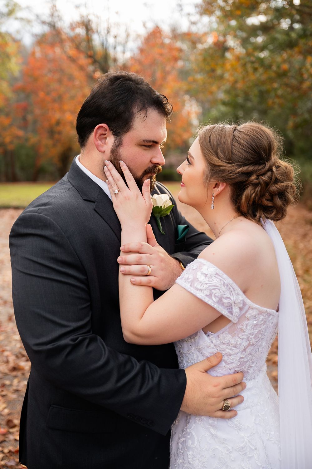 A romantic autumn wedding photoshoot showing tender moments between a couple in a white dress and black suit.