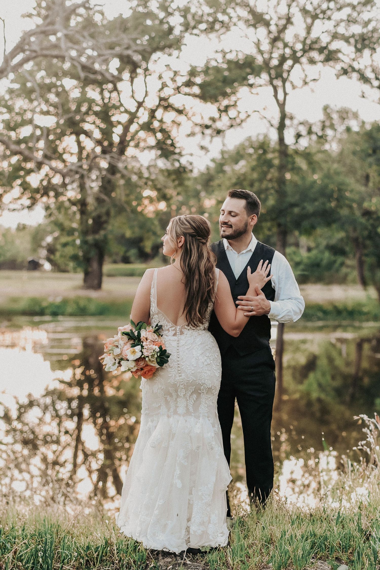 Emotional spring wedding portrait capturing a quiet moment between the newlyweds.
