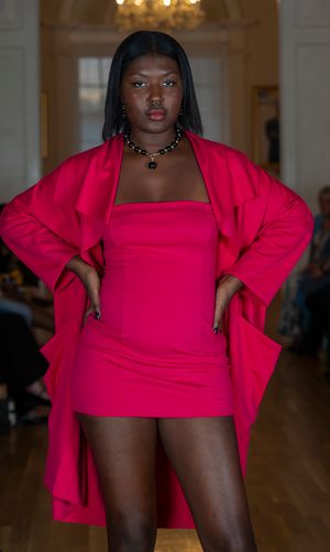 Fashion model poses in vibrant hot pink outfit against interior backdrop in progressive sequence of shots.