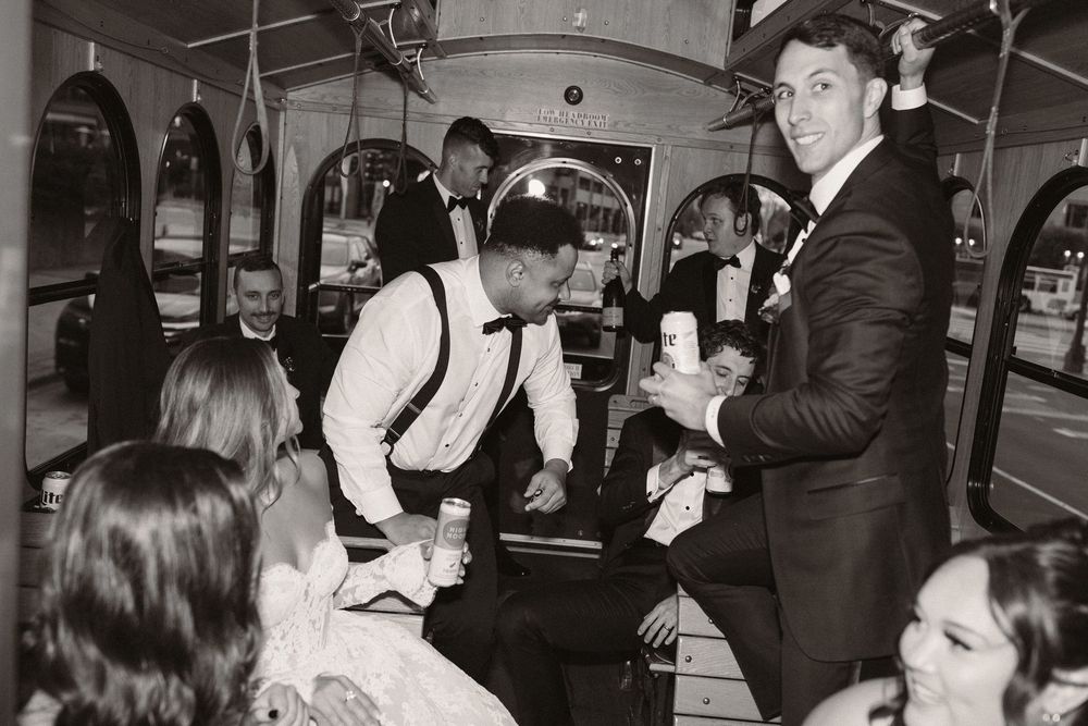 Black and white photo of people dancing and socializing at a party or gathering in what appears to be the 1950s or 1960s.
