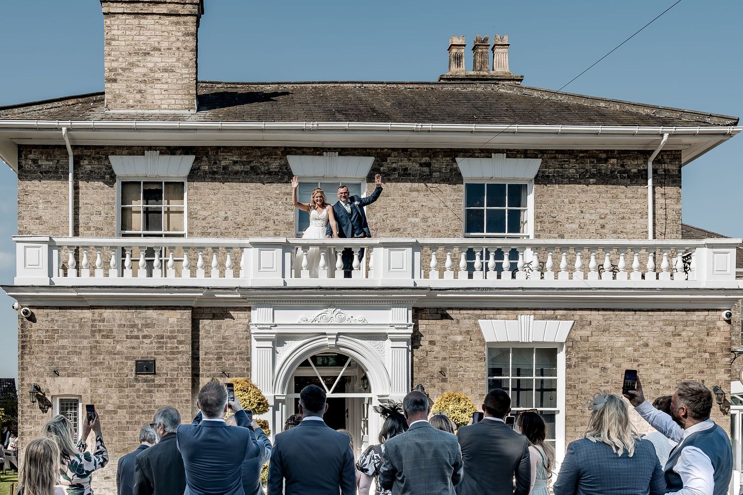 Candid wedding moments and guest reactions during couple exit.