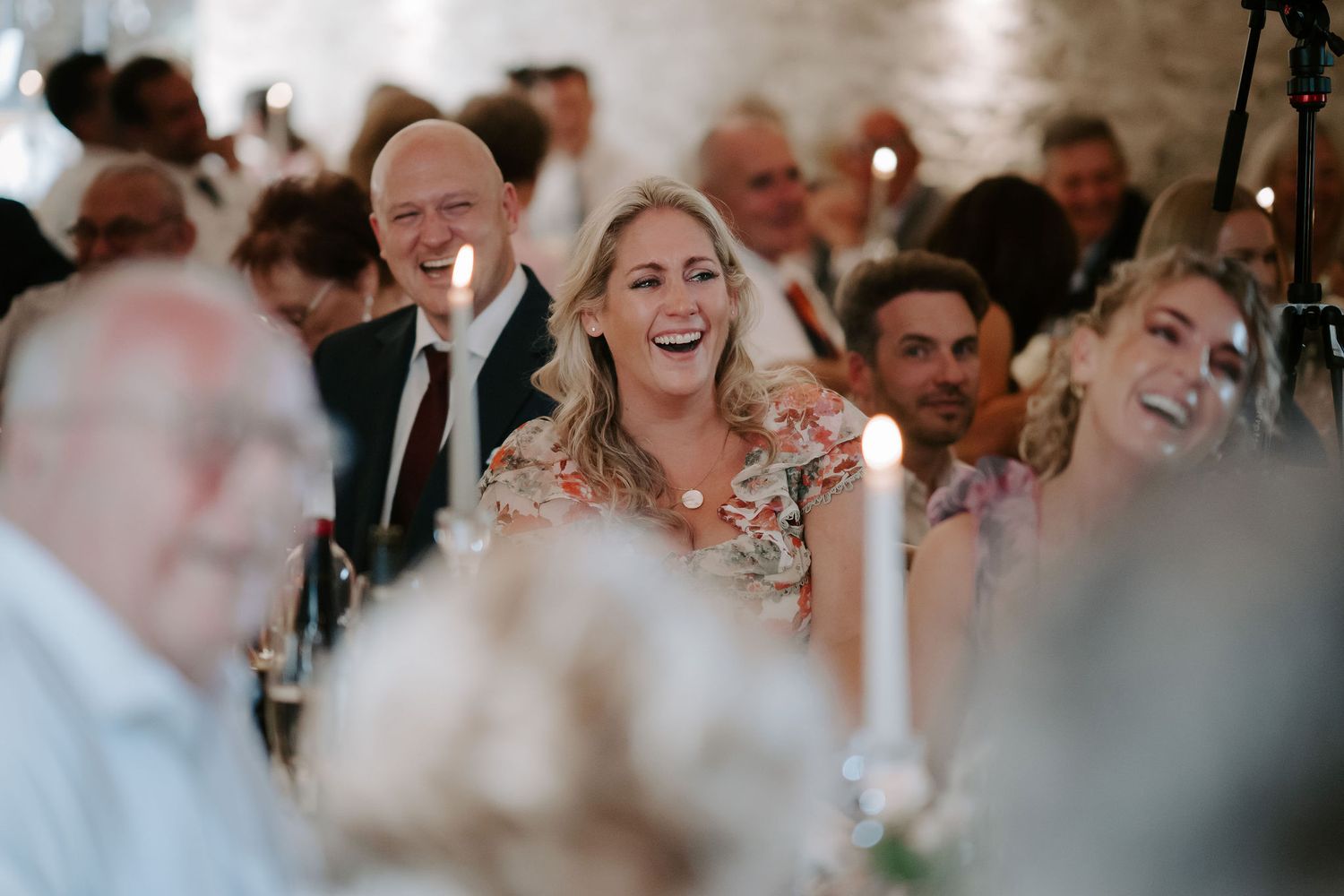 wedding guests laughing during father of bride speech at ivy lodge in cirencester