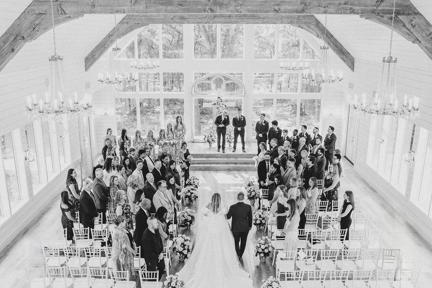 Bride walking down the aisle with her dad during the wedding ceremony