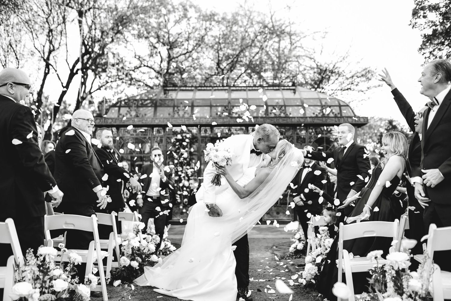 passionate moment of bride and groom dipping after their wedding