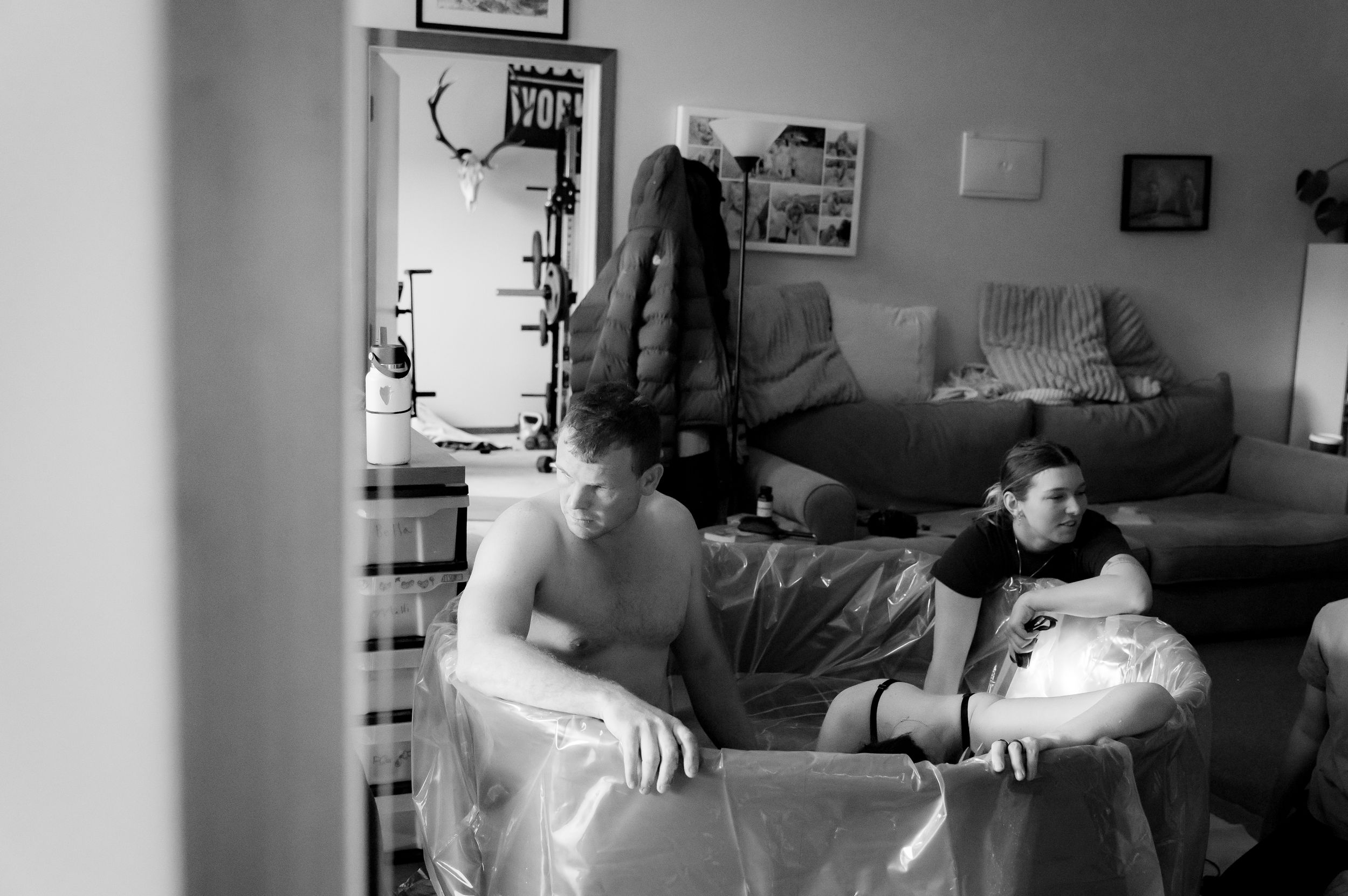 Mother labouring at home surrounded by family support