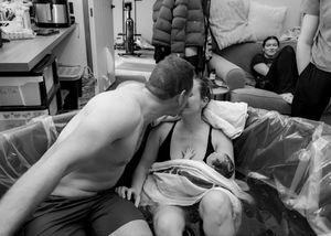 Emotional birth photography documenting baby's first moments
