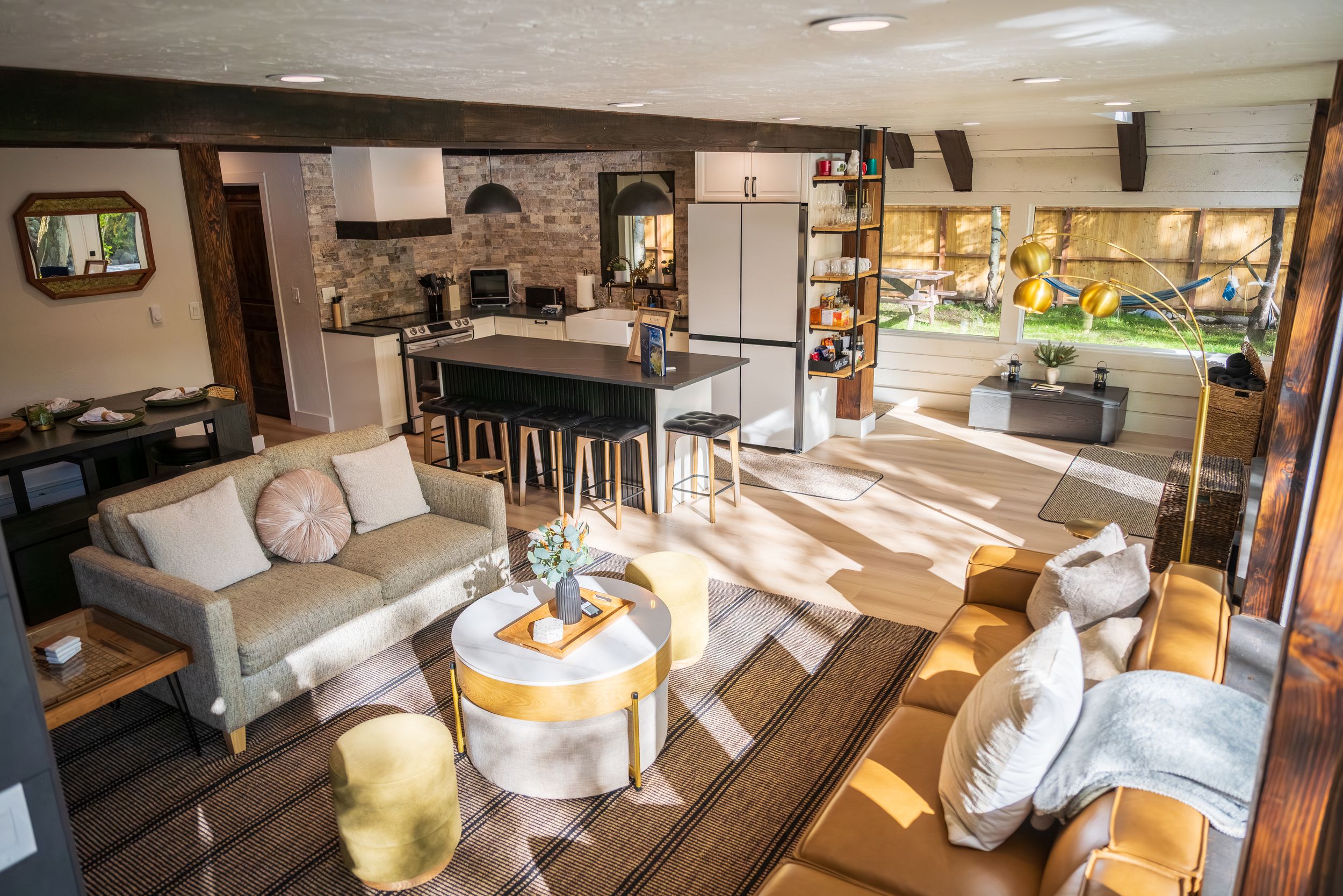 Living room and kitchen at River's Edge in Crested Butte by Denver Hospitality, Travel & Tourism photographer Captain Colorado Photography.